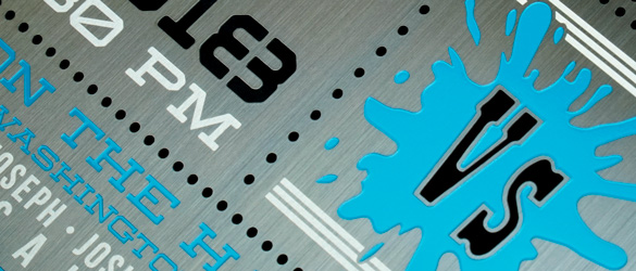 close up of blue screen printed area on gunmetal invitation