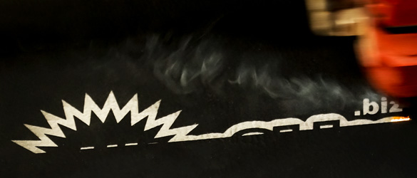 close up of laser etching on black leatherette