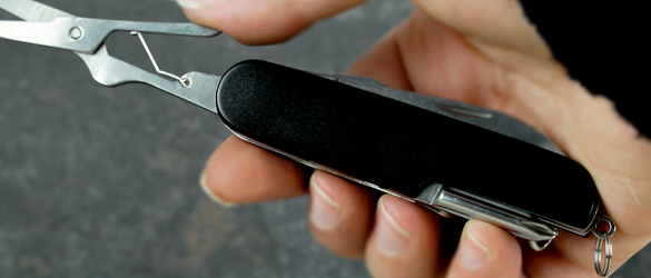 Black Pocket Knife in Hand
