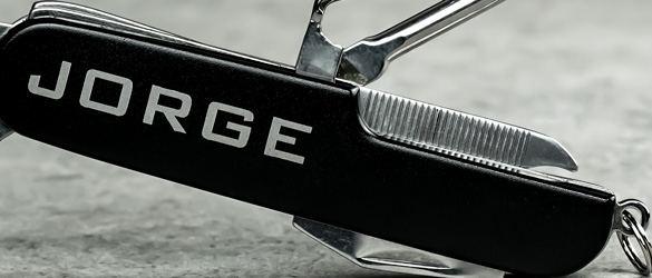 Close up of etching on black pocket knife