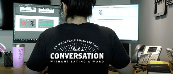 Graphic Designer Working on metal business card order