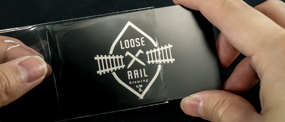 clear plastic sleeve on a quick metal business card