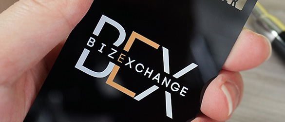 matte black metal business cards in three unique finishes close-up