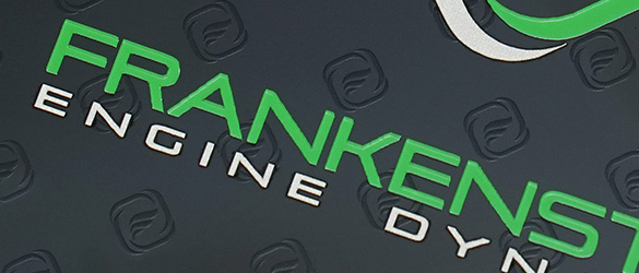 close up photo of screen printing on a black metal business card