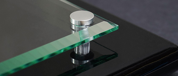 close up of corner of black piano finish plaque