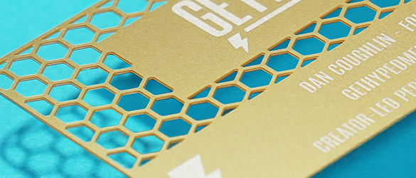 Close Up of brass quick metal card with cutouts