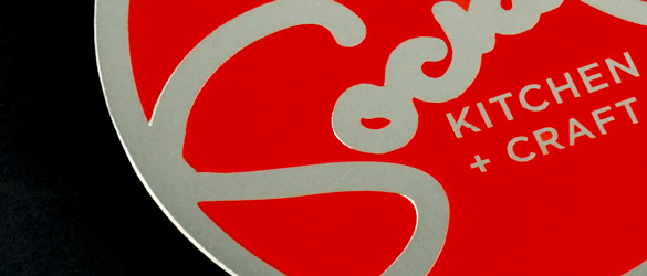 metal business card showing sceren printed red spot color on surface