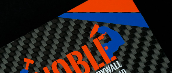two screen printed colors on a carbon fiber business card