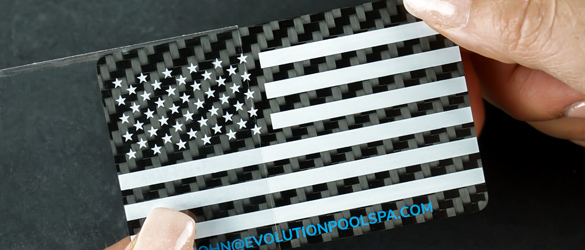 clear plastic sleeve on a carbon fiber business card